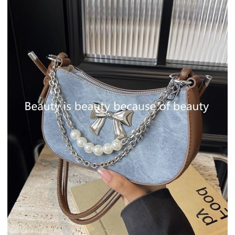 Luxury Bags China Wholesale - 高品質人気販売卸売ニッチデザインパールボウ軽量ショルダーバッグファッション高級チェーンピーバッグクロスボディバッグ女性用